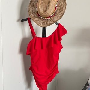 Red one shoulder swimsuit.